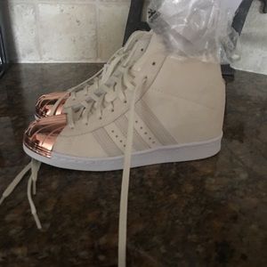 COPY - Rose Gold shell toe Adidas with hidden wedges.